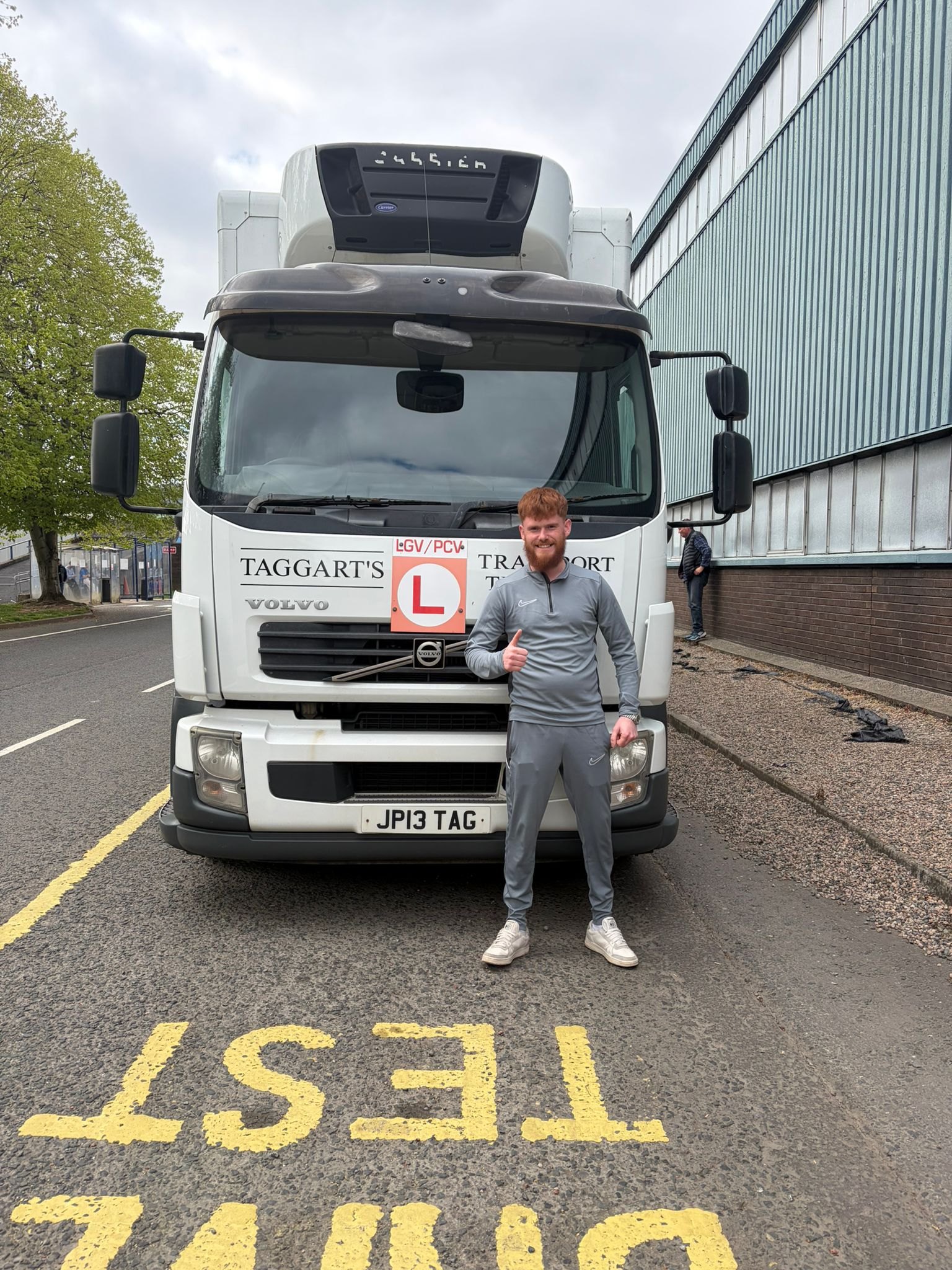 Learner standing beside a Taggart LGV training vehicle